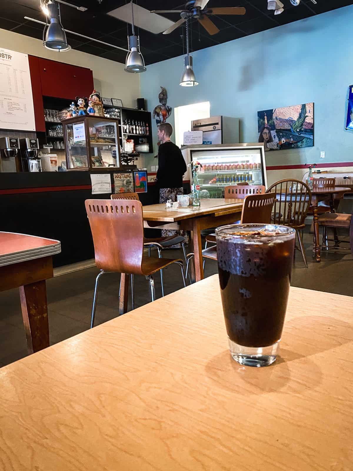A dark iced coffee in a quiet coffee shop in downtown Raleigh NC