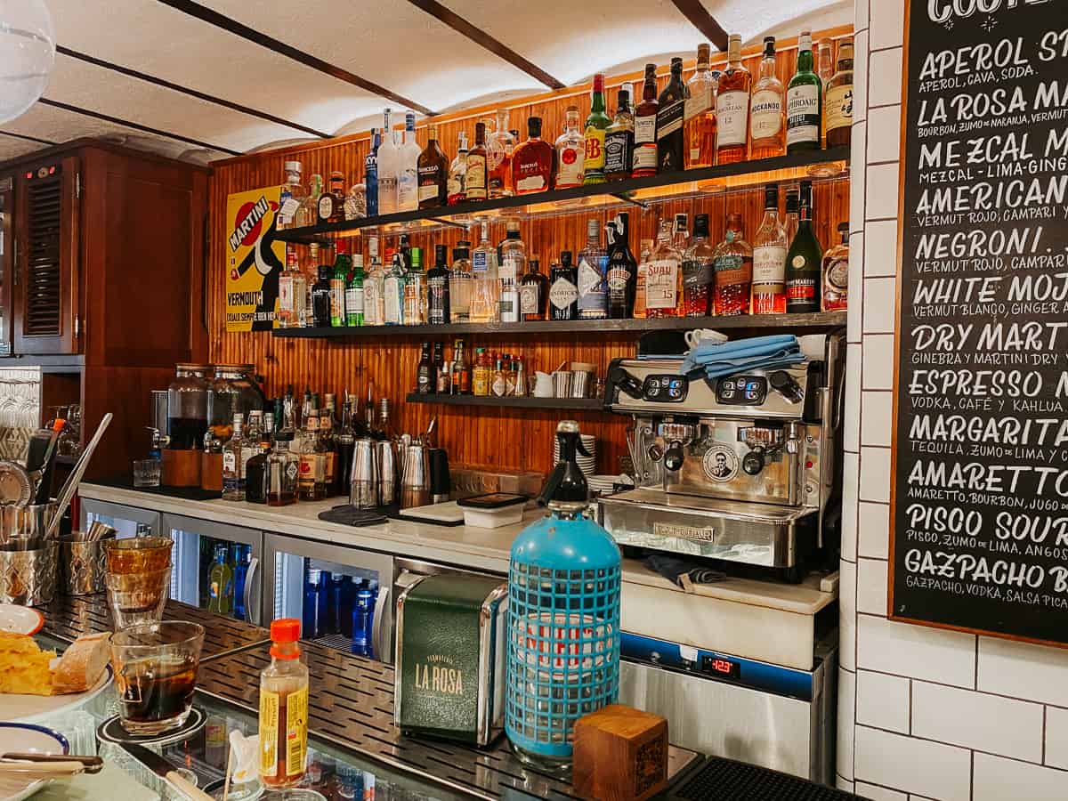 A vermouth bar with alcohol on shelves