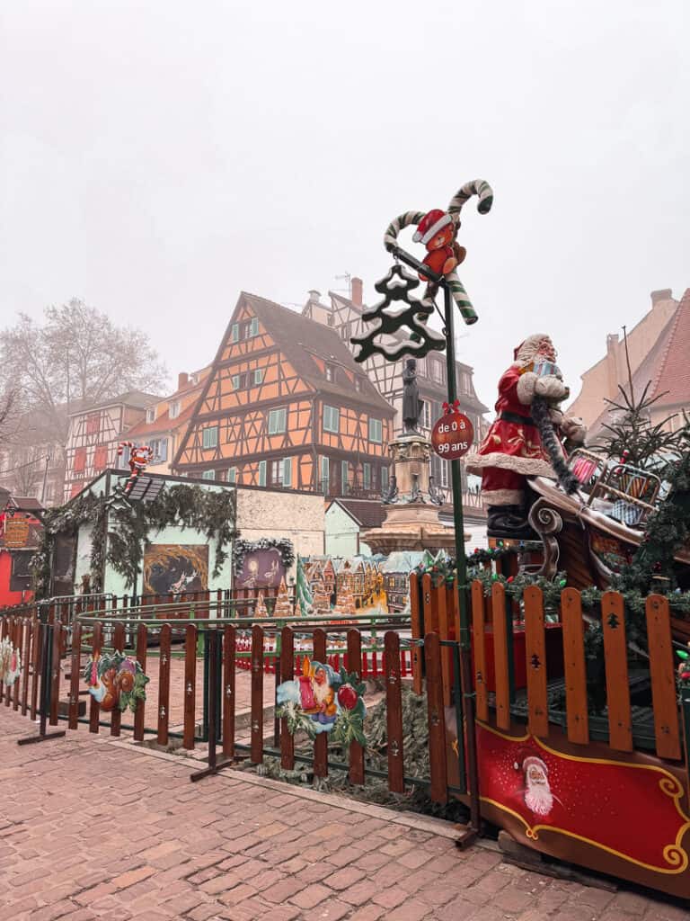 a tacky Chrismas market in colmar with gaudy christmas decorations