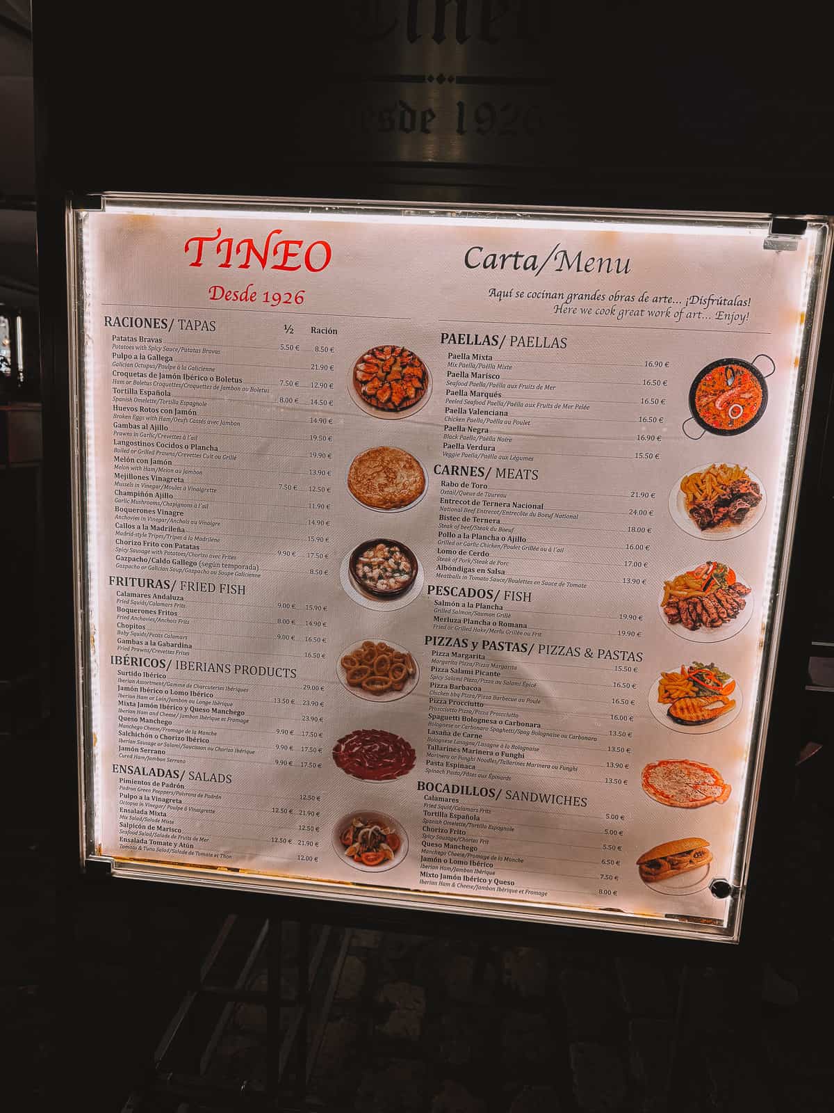 a tourist trap restaurant menu in Madrid with photos