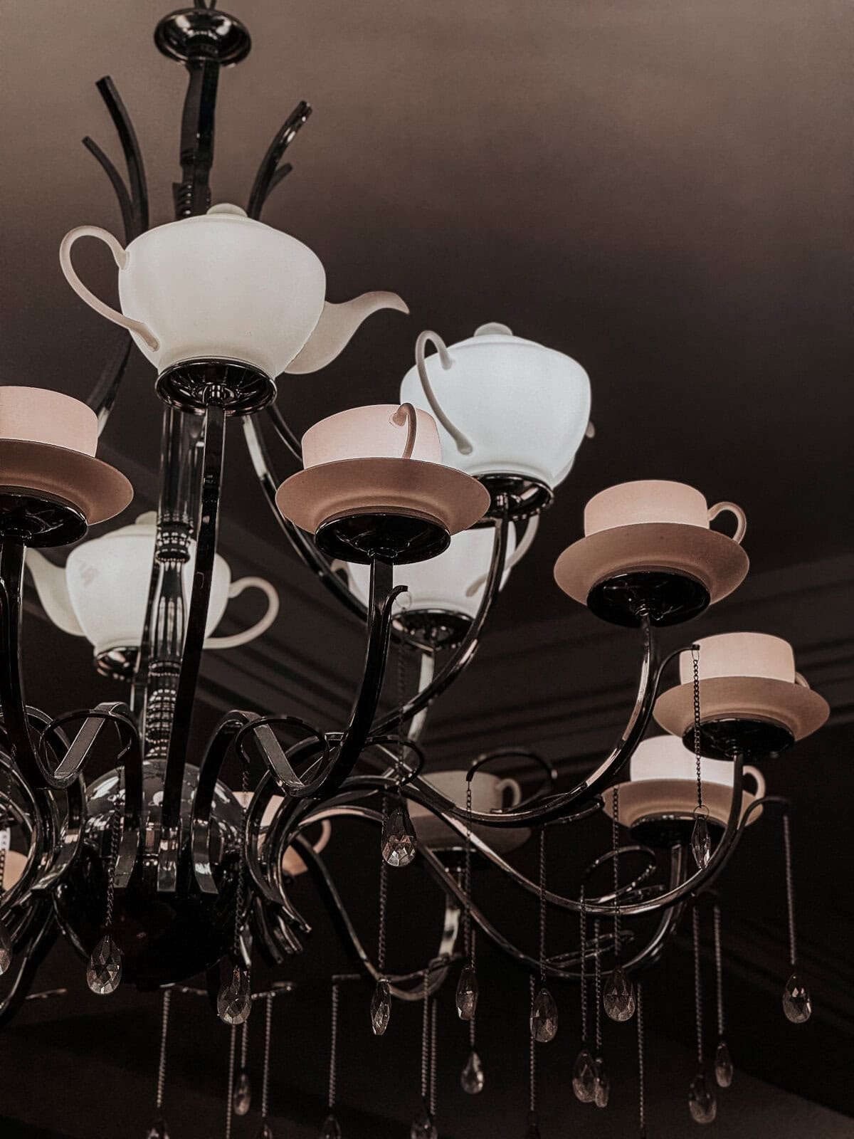 a unique chandelier made of tea pots and tea cups