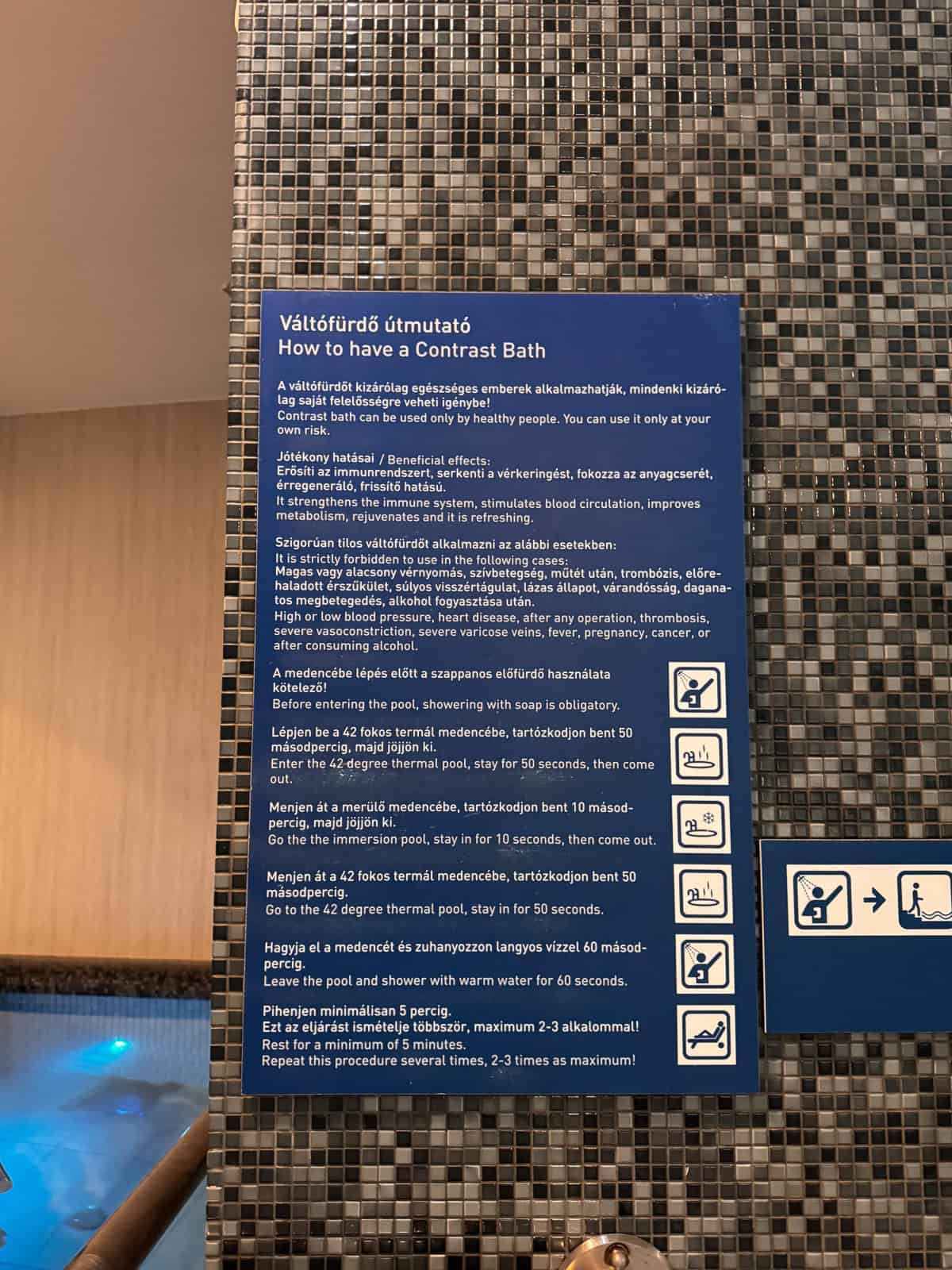 Image showing a sign titled 'How to have a Contrast Bath' with detailed instructions in both Hungarian and English at Rudas Gyógyfürdő (Rudas Baths).